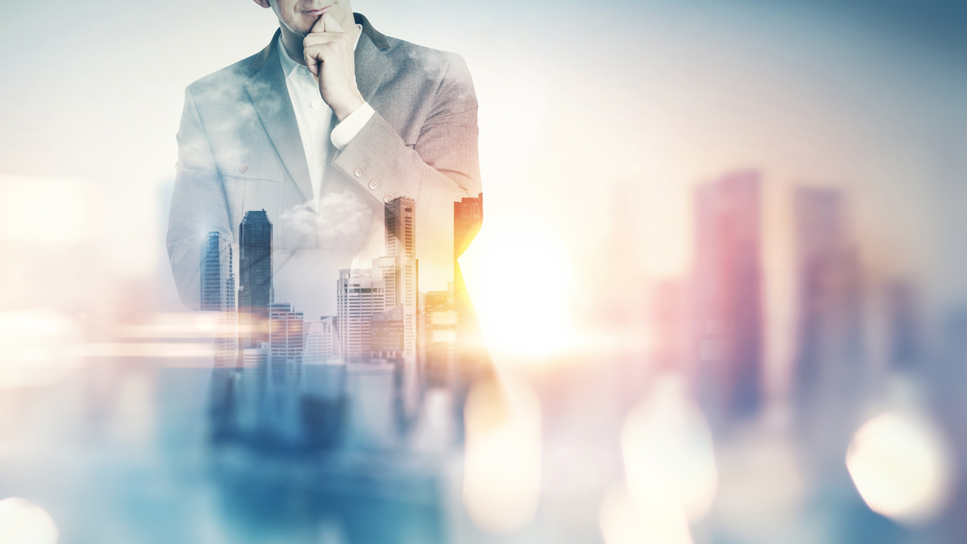 Businessman pondering with city skyline double exposure